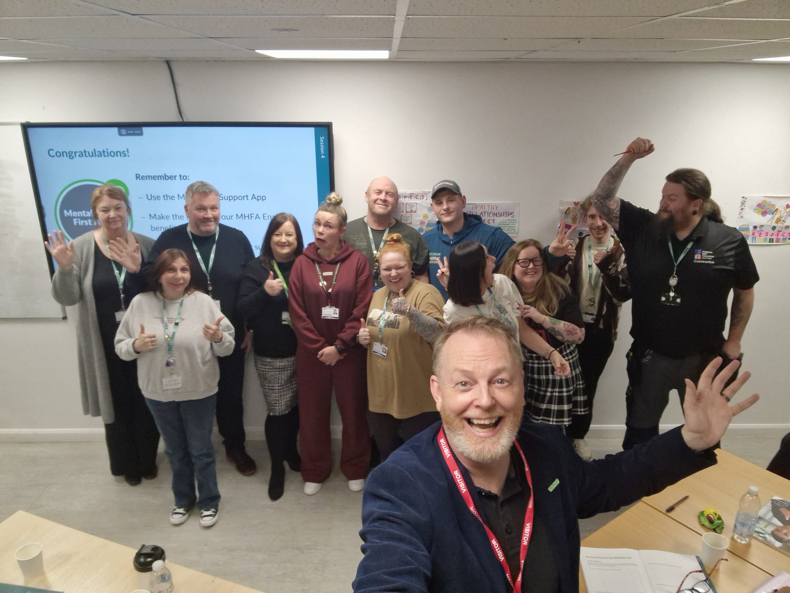 Participants receiving certificates after completing training