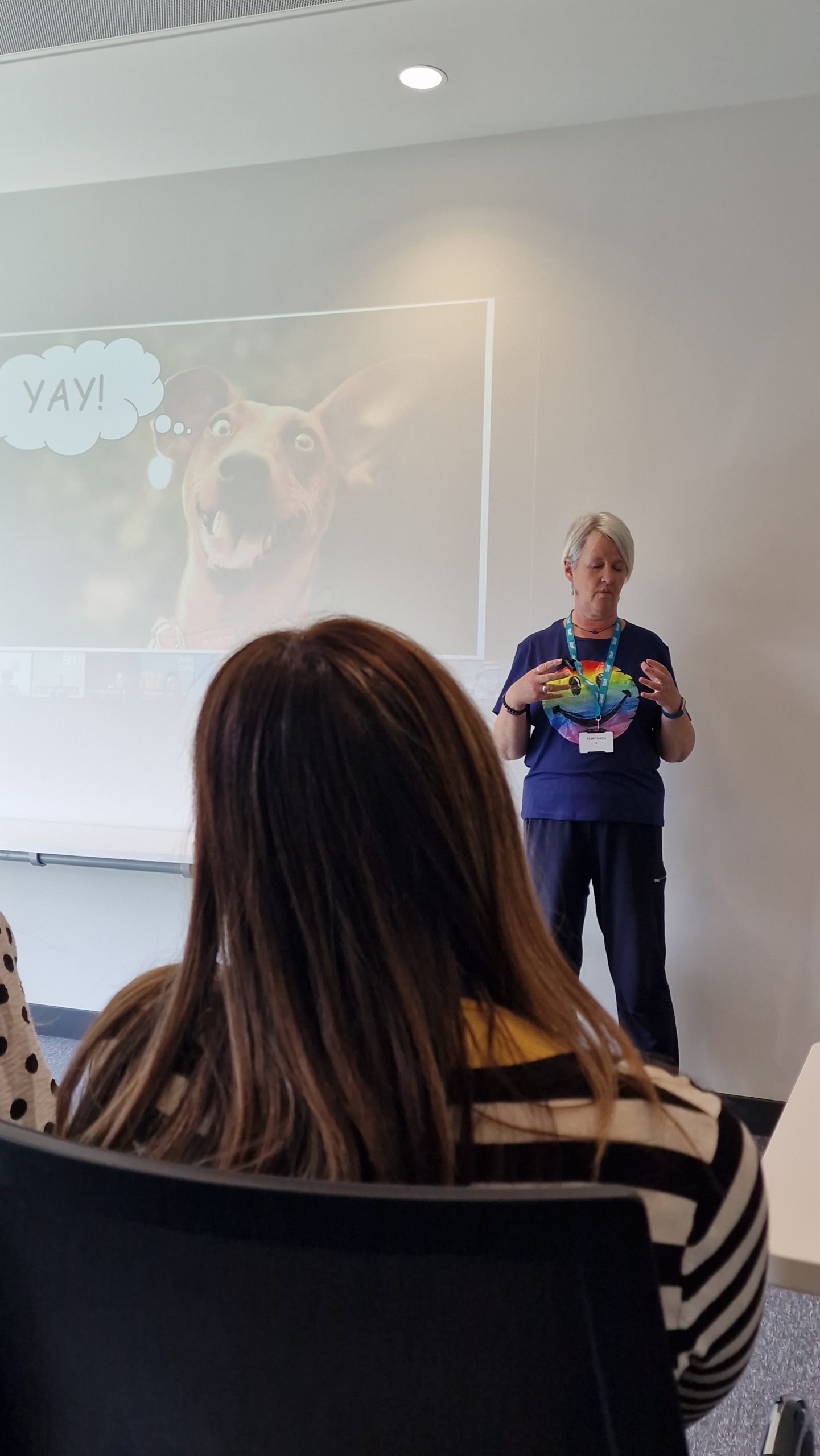 Facilitator leading an interactive wellbeing exercise